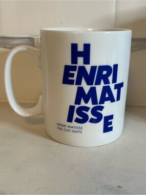 Moma White Ceramic Mug with Bold Blue 'Henri Matisse' Text